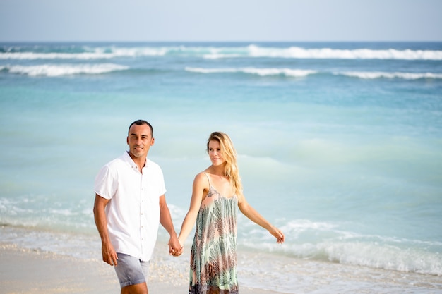 Content Couple Walking on Beach on Vacation