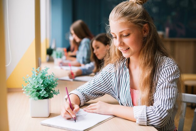 Content girl taking notes in notepad