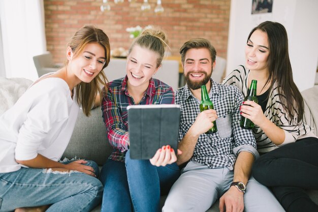 Content laughing friends taking selfie