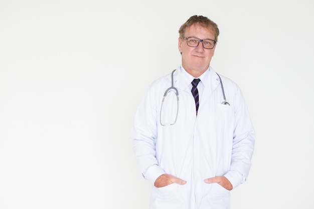 Content Mature Doctor with Hands in Pockets