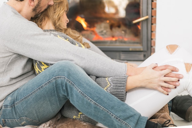 Content people lounging near fireplace