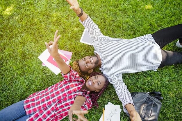 Content students posing on ground