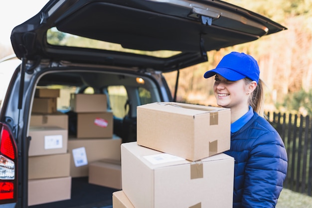 Content woman carrying boxes