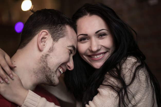 Content woman embracing man 