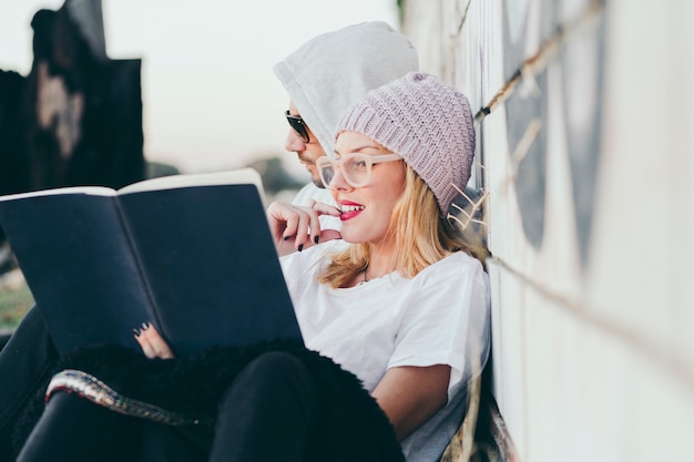 Content woman sharing notepad with boyfriend