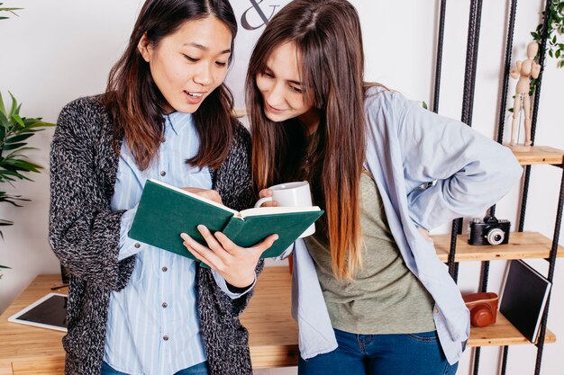 Content women exploring interesting book