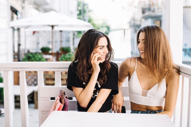 Content women spending time together in mall