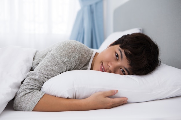 Content Young Asian Girl Resting in Bed