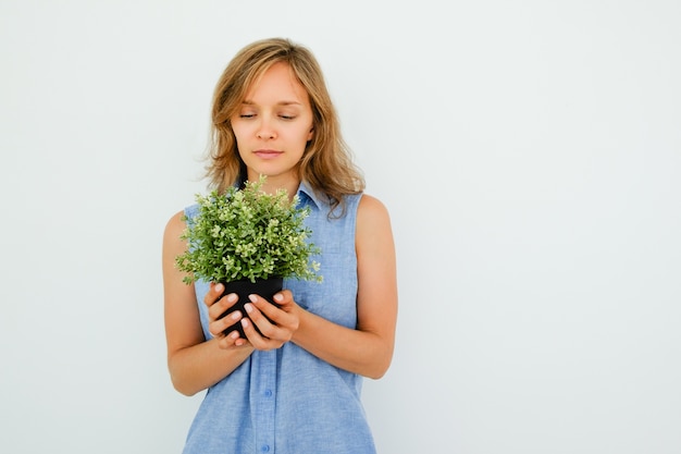 Content Young Beautiful Woman Holding Pot Plant