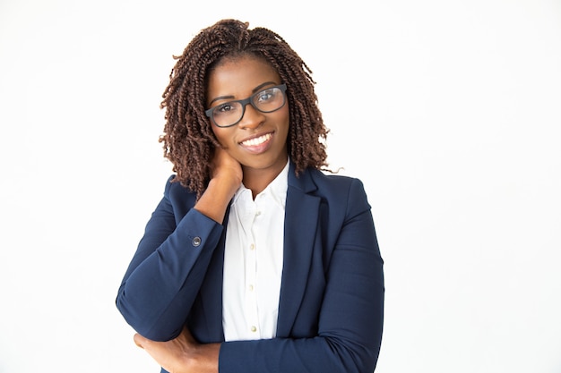 Content young businesswoman in eyeglasses