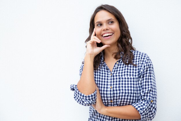 Content young woman with hand on cheek