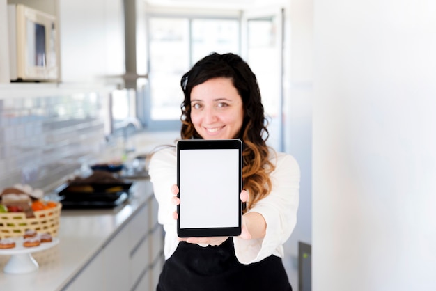 Free photo cook presenting tablet