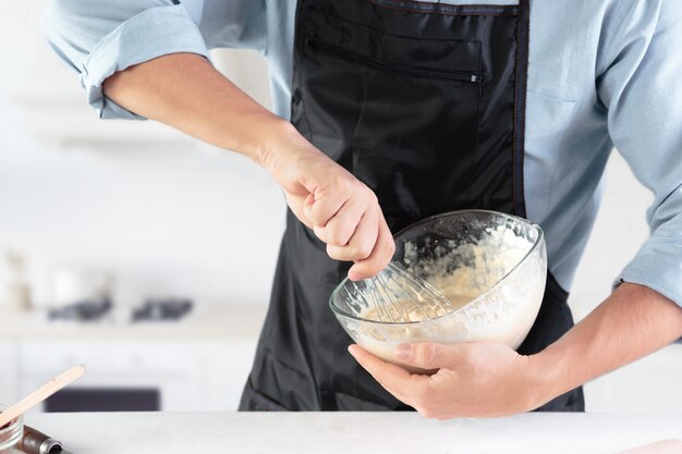 cook with eggs on a rustic kitchen