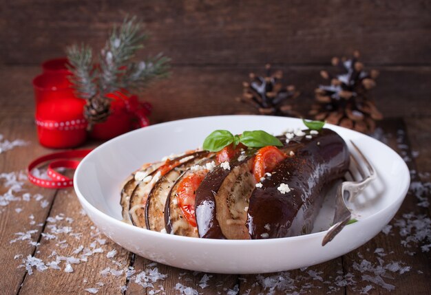 Cooked aubergines with a fork