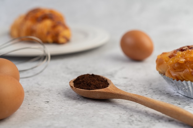 Cooked bread with ingredients Eggs and tapioca flour in a cup.