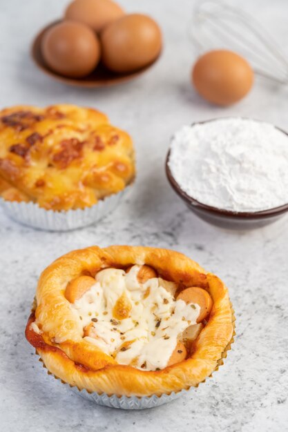 Cooked bread with ingredients Eggs and tapioca flour in a cup.