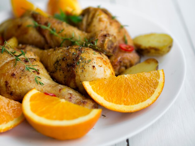 Cooked chicken legs with herbs