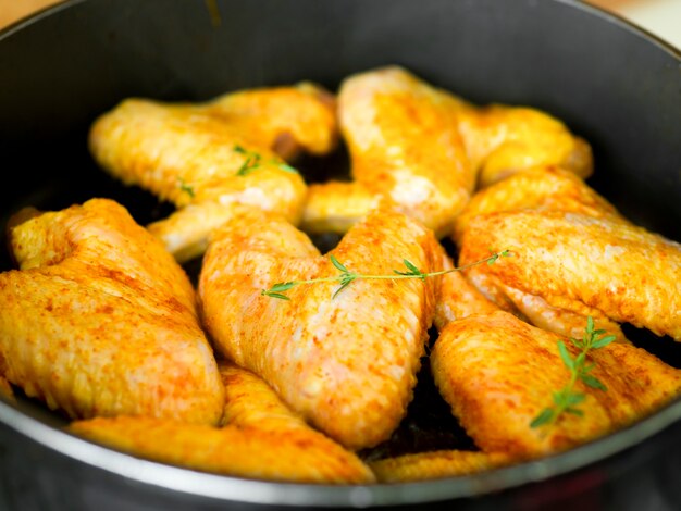 Cooked chicken wings with herbs