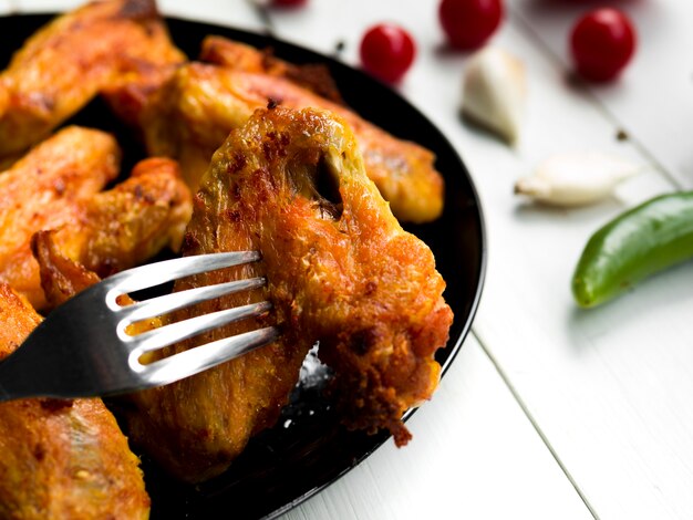 Cooked chicken wings with herbs