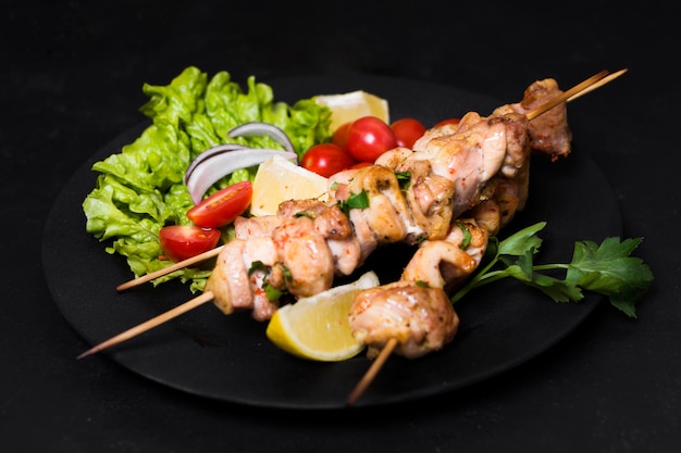 Cooked meat and veggies kebab high view