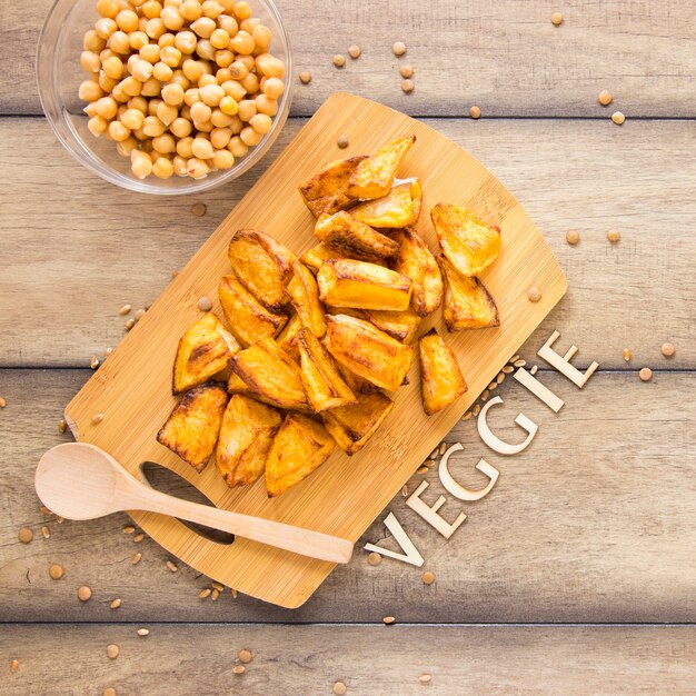 Cooked potatoes on wooden board