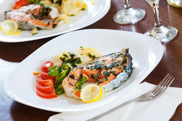 Cooked salmon fish in plate
