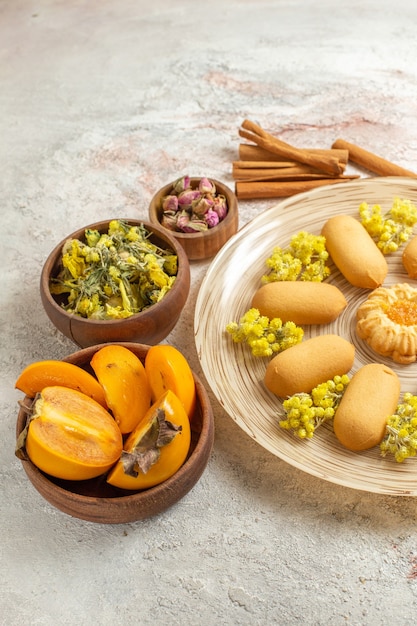 cookie plate and cinnamons and dry lavender and yellow flowers and palms