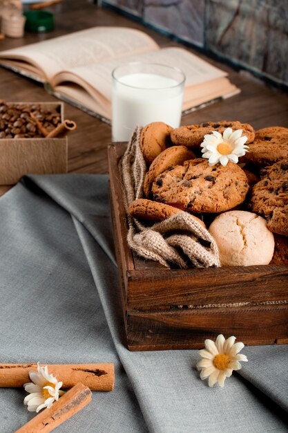 Cookie tray on a blue tablecloth with a book