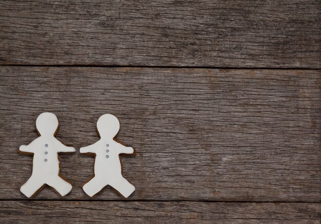 Cookie with person shape on a wooden table