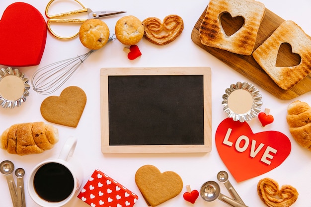 Free photo cookies and buns around chalkboard