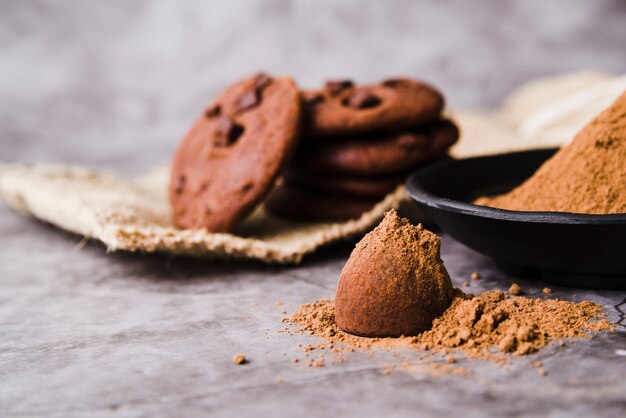 Cookies and chocolate truffle dusted with cocoa powder