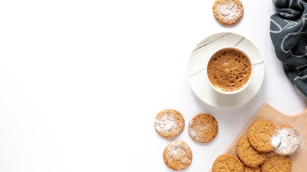 Free photo cookies and a cup of coffee with copy space