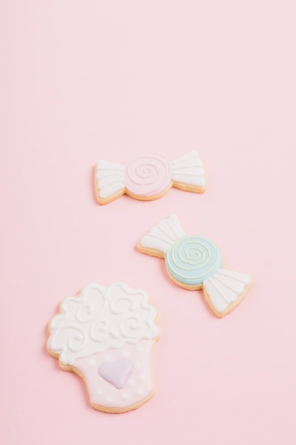 Cookies of different shape on pink background