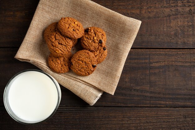 cookies and Glass milk on wood table.