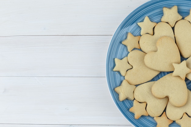 Cookies in a plate close-up on a wooden background