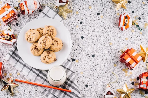 Cookies on plate with Christmas toys 