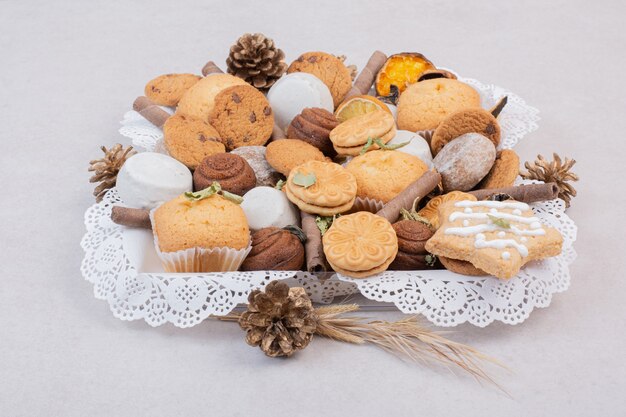 Cookies on rope in plate on white