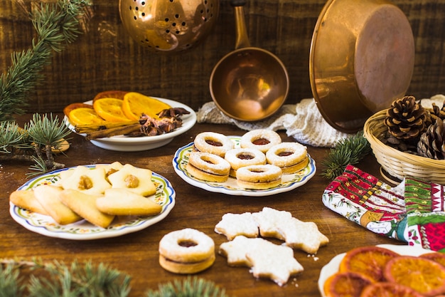 Cookies and spices on wooden table