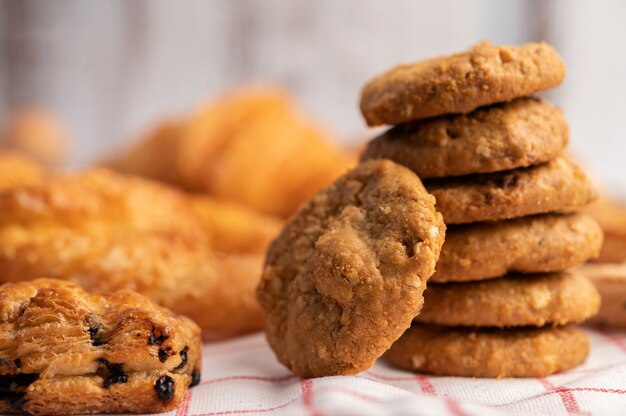 Cookies stacked on a white-red cloth.