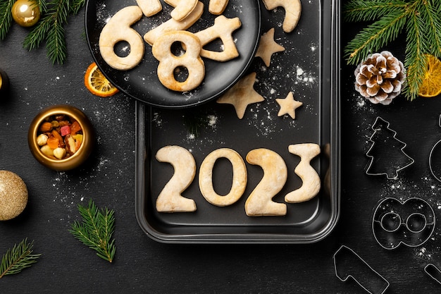 Free photo cookies on tray new year celebration top view