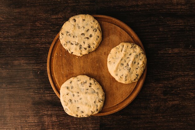 Cookies with chocolate on wooden board