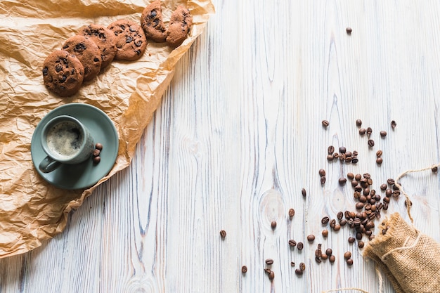 Cookies with coffee set and coffee beans