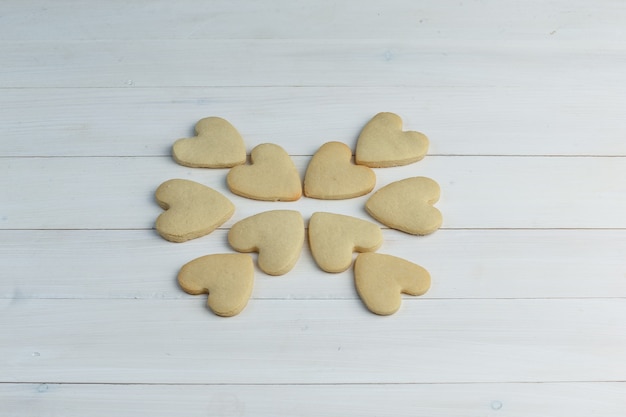 Free photo cookies on a wooden background. high angle view.