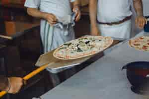 Free photo cooking big pizza