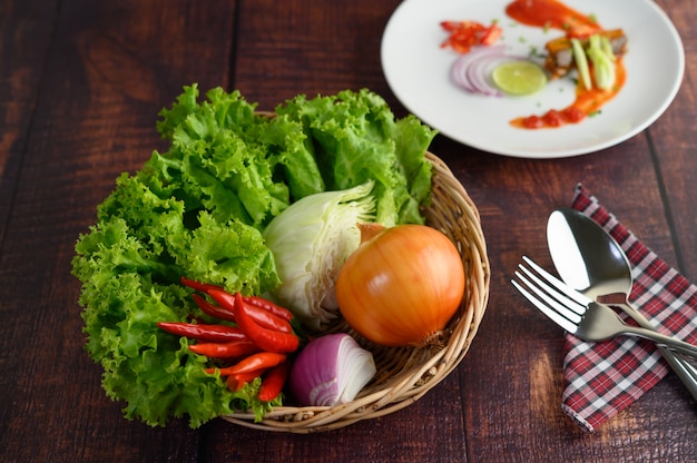 Cooking ingredient in weave basket and sardine with tomato sauce