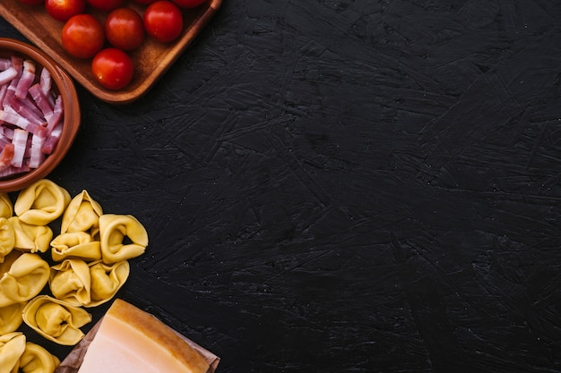 Cooking ingredients near stuffed pasta