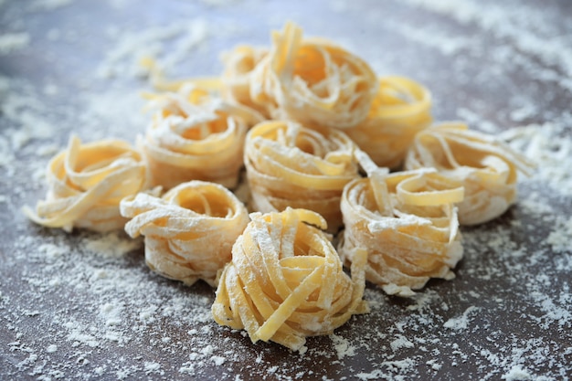 Cooking Italian homemade pasta  on dark background