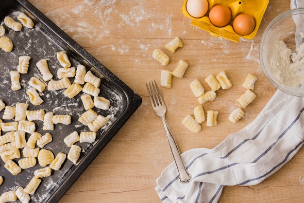 Cooking italian homemade potato gnocchi with ingredients