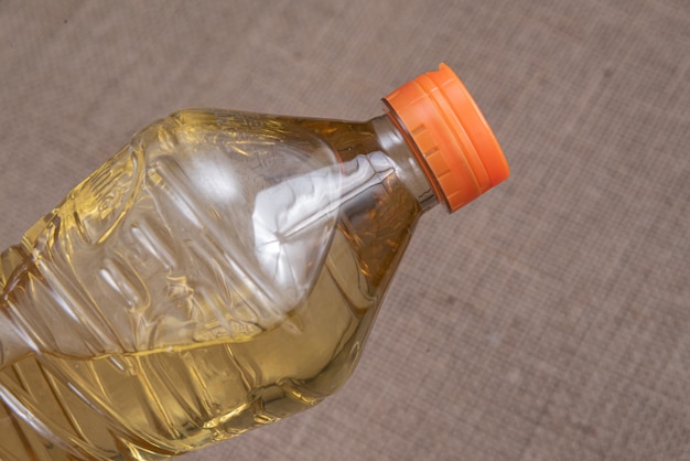 Cooking oil on the brown jute background