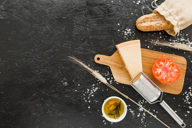 Cooking set with cheese bread and tomato